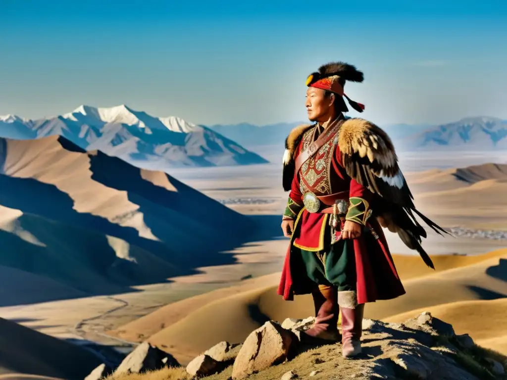 Un cazador tradicional de águilas en Mongolia, con su majestuoso águila dorada, en lo alto de una escarpada montaña